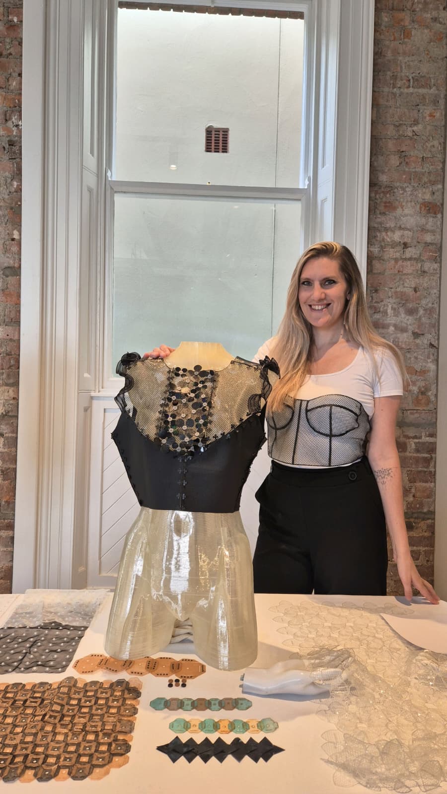 Jojanneke presenting a 3D printed corset alongside textile experiments