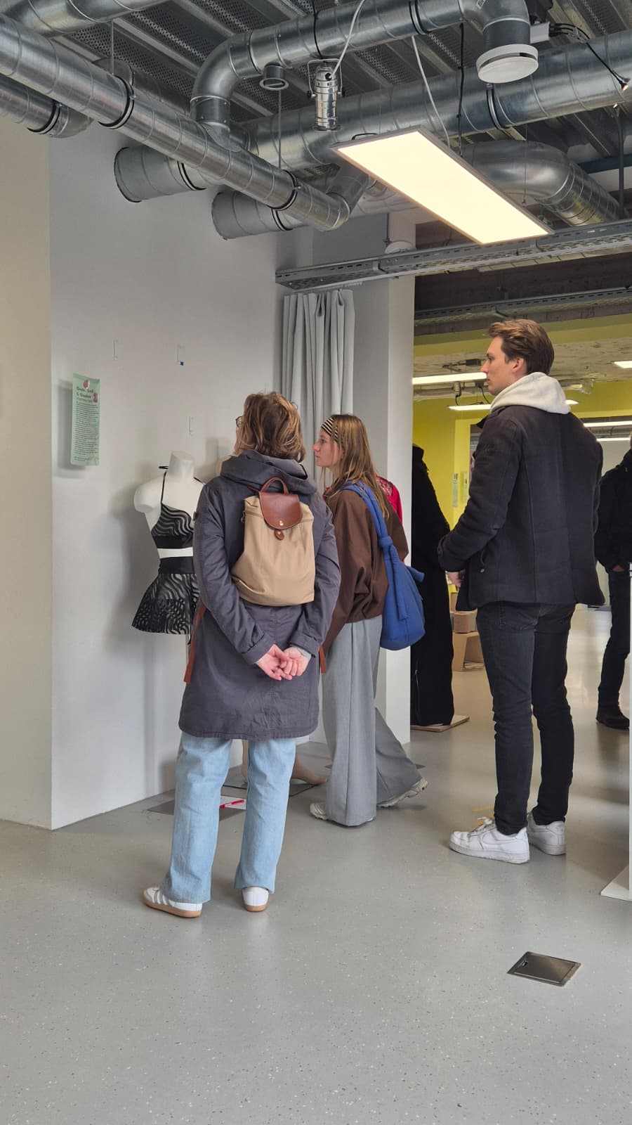 Visitors viewing Jojanneke Tamis's 3D-printed fashion at the Fashion Tech Farm, Dutch Design Week 2026
